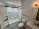 Modern bathroom with tub shower combination with updated fixtures and finishes at , Indianapolis, IN 46227