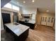 Modern kitchen with granite countertops, an island sink, stainless appliances, and hardwood floors at , Indianapolis, IN 46227