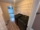Laundry room with washer and dryer, shelving for storage, and access to the garage at , Indianapolis, IN 46227