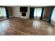 Spacious living room showcasing a brick fireplace, recessed lighting, and updated flooring at , Indianapolis, IN 46227