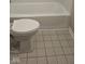 Close up of a standard toilet and floor tiles in a bathroom at 705 Orchard Ln, Greenwood, IN 46142