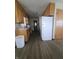 Galley kitchen with wood cabinets and vinyl floors at 705 Orchard Ln, Greenwood, IN 46142