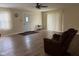 Inviting living room featuring wood-look floors and a comfortable armchair at 705 Orchard Ln, Greenwood, IN 46142