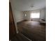 Living room featuring neutral paint, vinyl floors, and natural light at 705 Orchard Ln, Greenwood, IN 46142