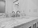 Bathroom vanity featuring a marble countertop and unique cabinet design at 720 Blanchard St, Shelbyville, IN 46176