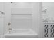 Bathroom with white subway tile surrounding the tub and a stylish vanity at 720 Blanchard St, Shelbyville, IN 46176