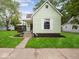 Charming single-Gathering home with light green siding, a covered porch, and a well-manicured front lawn at 720 Blanchard St, Shelbyville, IN 46176