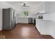 Updated kitchen with stainless steel appliances, wood-look flooring, and white cabinets at 720 Blanchard St, Shelbyville, IN 46176