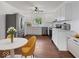 Open kitchen layout with stainless steel appliances, white cabinetry, and a view of the backyard from the window at 720 Blanchard St, Shelbyville, IN 46176