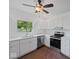 Updated kitchen with white cabinetry, stainless steel appliances, and a view to the outdoors at 720 Blanchard St, Shelbyville, IN 46176