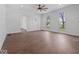 Open-concept living area with hardwood floors, white walls, and abundant natural light from large windows at 720 Blanchard St, Shelbyville, IN 46176