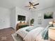 Cozy primary bedroom with stylish decor, a ceiling fan, and ample natural light at 720 Blanchard St, Shelbyville, IN 46176