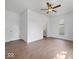Bright primary bedroom with modern ceiling fan and ensuite bathroom access at 720 Blanchard St, Shelbyville, IN 46176