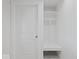 Mud room with a door, bench, storage, and a door leading outside at 720 Blanchard St, Shelbyville, IN 46176