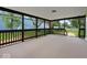 Spacious screened porch with railing offers an ideal space for relaxation and outdoor living at 720 Blanchard St, Shelbyville, IN 46176