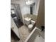Angle view of a bathroom featuring a single sink vanity, toilet and bath tub with tan tile flooring at 733 Haugh St, Indianapolis, IN 46222