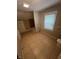 Bathroom featuring a window, toilet, tiled floors and a bath tub at 733 Haugh St, Indianapolis, IN 46222