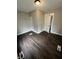 This bedroom features modern dark wood flooring and fresh, neutral-tone paint at 733 Haugh St, Indianapolis, IN 46222