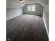 Bedroom featuring neutral walls, base trim, carpeted flooring and window at 733 Haugh St, Indianapolis, IN 46222