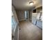 Functional kitchen with white appliances, neutral tile flooring, and space for dining at 733 Haugh St, Indianapolis, IN 46222