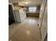 Bright kitchen features white appliances, light wood cabinets, and neutral tile flooring at 733 Haugh St, Indianapolis, IN 46222