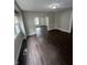 Open-concept living room with new flooring, fresh paint, and abundant natural light at 733 Haugh St, Indianapolis, IN 46222