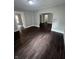Spacious living room featuring new flooring and fresh paint, creating a welcoming atmosphere at 733 Haugh St, Indianapolis, IN 46222