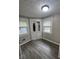 Cozy room with new flooring, built-in cabinet and good natural light at 733 Haugh St, Indianapolis, IN 46222