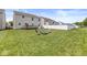 Expansive backyard featuring a fire pit with chairs, perfect for outdoor gatherings and relaxation at , Greenwood, IN 46143