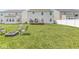 Lush backyard with well-maintained lawn, fire pit and chairs, and a deck for outdoor living at , Greenwood, IN 46143