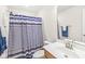 Bathroom with blue striped shower curtain, and a single sink vanity at , Greenwood, IN 46143