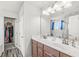 This bathroom features a double sink vanity and a view of the shower at , Greenwood, IN 46143