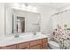 Bright bathroom featuring a double sink vanity and floral shower curtain at , Greenwood, IN 46143
