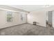 Empty bedroom with neutral walls, carpeted floors, and two bright windows at , Greenwood, IN 46143