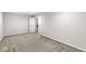 Bedroom with neutral walls, plush carpeting, and white doors at , Greenwood, IN 46143