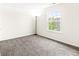 This bedroom features gray carpeting and a large bright window at , Greenwood, IN 46143