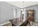 Well-lit dining area with a wooden table, bench, a chandelier and a vintage hutch at , Greenwood, IN 46143