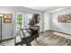 Inviting living room with a black piano, a window, and views of the front door at , Greenwood, IN 46143
