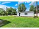 The charming home features a lush green lawn and a back entrance to the house at 7455 W 700 N, Fairland, IN 46126