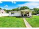 The home features a covered back porch, ideal for enjoying the expansive backyard at 7455 W 700 N, Fairland, IN 46126