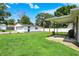 Expansive backyard featuring a detached garage and a covered patio at 7455 W 700 N, Fairland, IN 46126
