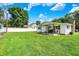 Charming home features a spacious backyard, a covered porch, and a stone chimney at 7455 W 700 N, Fairland, IN 46126