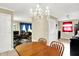 Inviting dining area with a chandelier and hardwood table, perfect for Gathering meals at 7455 W 700 N, Fairland, IN 46126