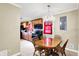 Bright dining room featuring a classic chandelier and view of the kitchen at 7455 W 700 N, Fairland, IN 46126