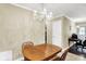 The dining room features a classic chandelier and view to a home office at 7455 W 700 N, Fairland, IN 46126
