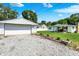 The property includes a two-car garage, a well-maintained lawn, and a charming house at 7455 W 700 N, Fairland, IN 46126