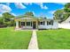 Charming single-story home with a covered front porch and a lovely swing for relaxing at 7455 W 700 N, Fairland, IN 46126