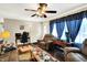 Comfortable living room with a large window, inviting seating, and a functional workspace at 7455 W 700 N, Fairland, IN 46126