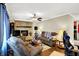 Warm living room showcases stone fireplace, plush seating, and an inviting atmosphere at 7455 W 700 N, Fairland, IN 46126