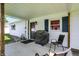 Cozy covered patio with seating, ideal for outdoor gatherings at 7455 W 700 N, Fairland, IN 46126